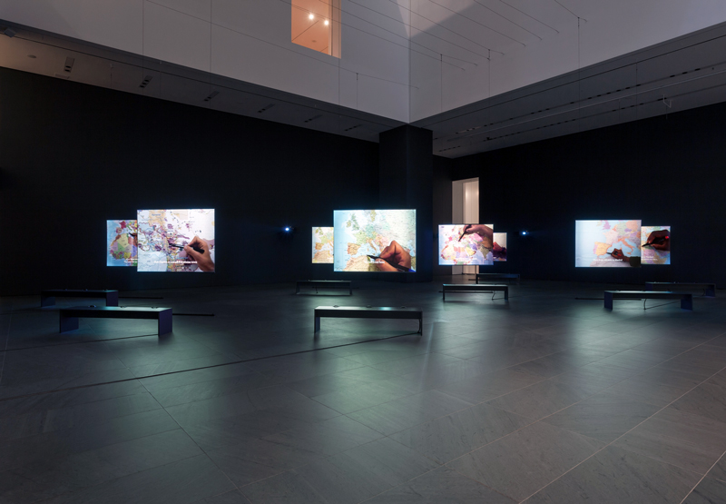 "The Mapping Journey Project". 2008–11. Eight-channel video (color, sound). Installation view, solo exhibition, "Bouchra Khalili: The Mapping Journey Project", The Museum of Modern Art, New York, April 9–October 10, 2016. Photo: Jonathan Muzikar