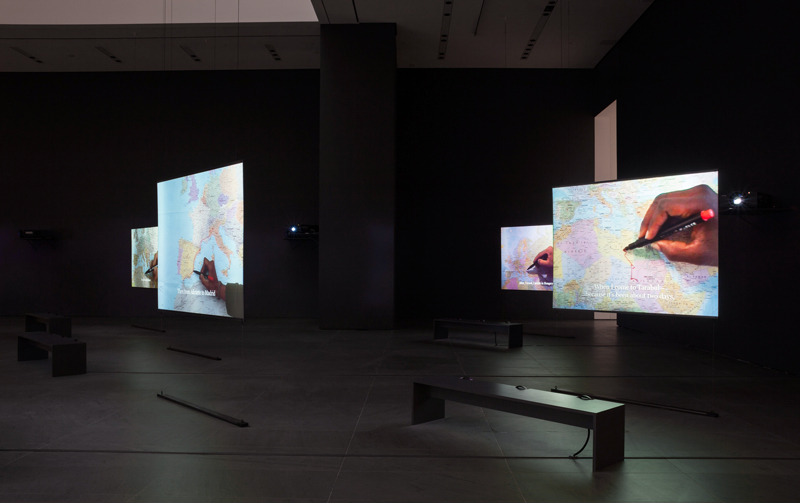 "The Mapping Journey Project". 2008–11. Eight-channel video (color, sound). Installation view, solo exhibition, "Bouchra Khalili: The Mapping Journey Project", The Museum of Modern Art, New York, April 9–October 10, 2016. Photo: Jonathan Muzikar